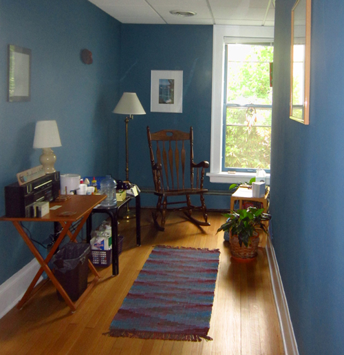 Have a seat in my waiting room - warm wood floors, rocking chair by the window, coffee